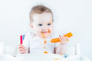 baby with carrot intro solid foods